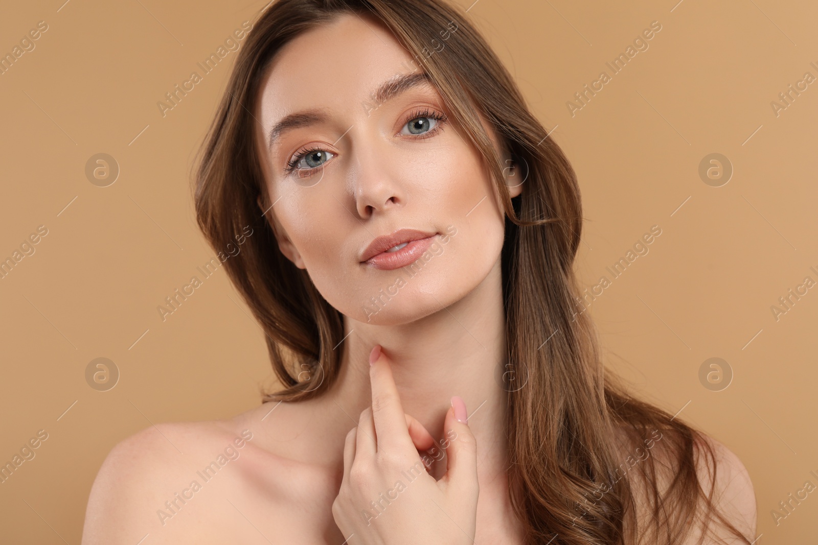 Photo of Beautiful woman with healthy skin on beige background