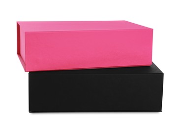 Photo of Black and pink shoe boxes on white background