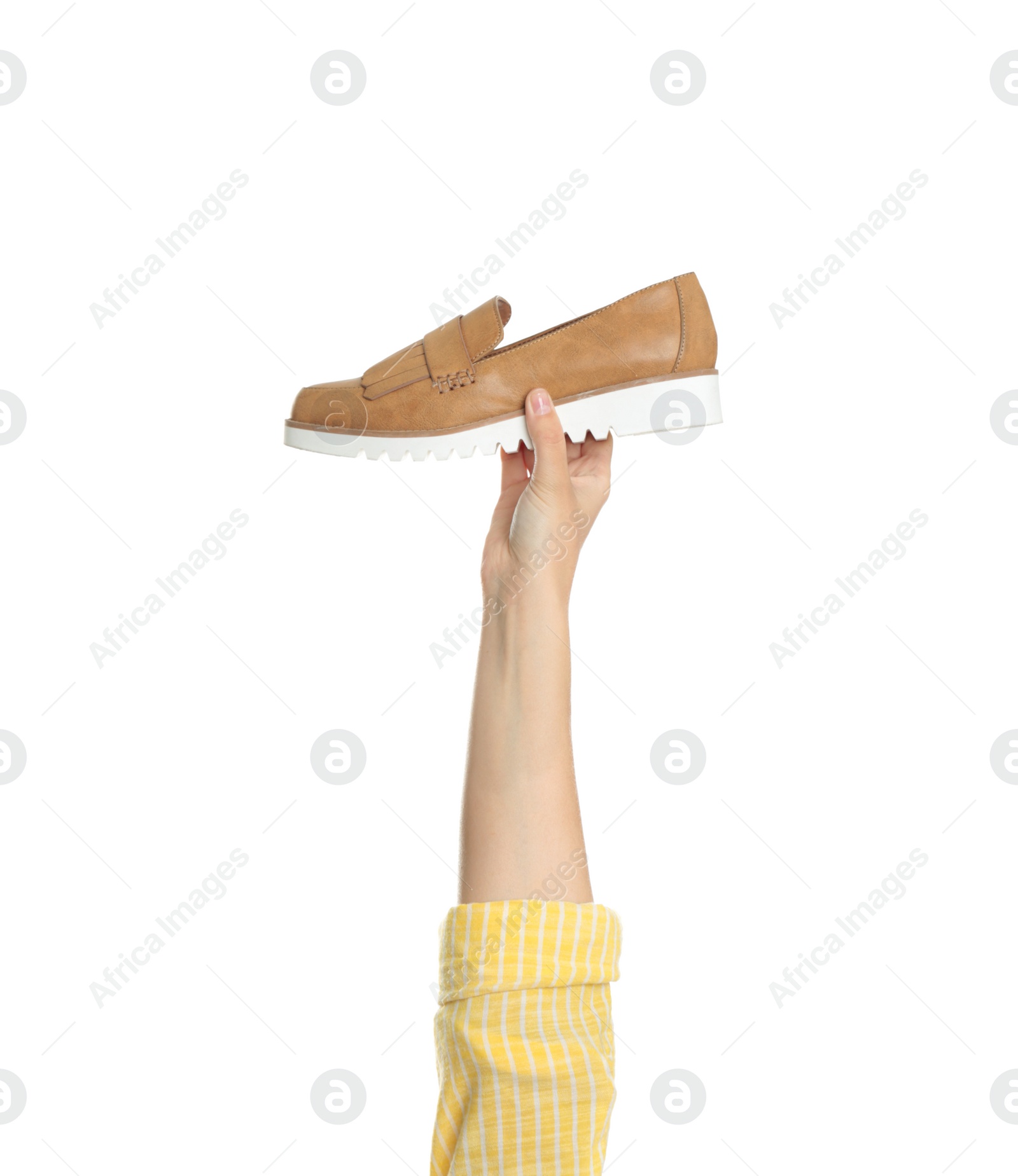 Photo of Young woman holding comfortable shoe on white background, closeup