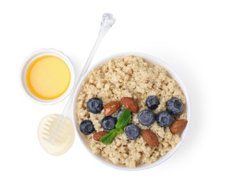 Bowl of delicious cooked quinoa with almonds, honey and blueberries on white background, top view