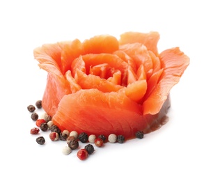 Flower made of fresh sliced salmon fillet on white background