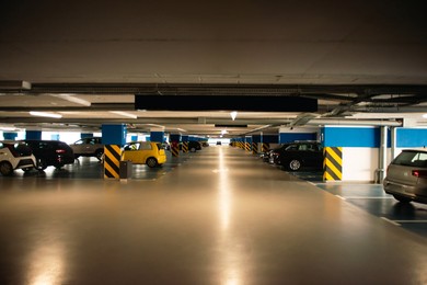 Photo of Clean parking garage with cars and lights