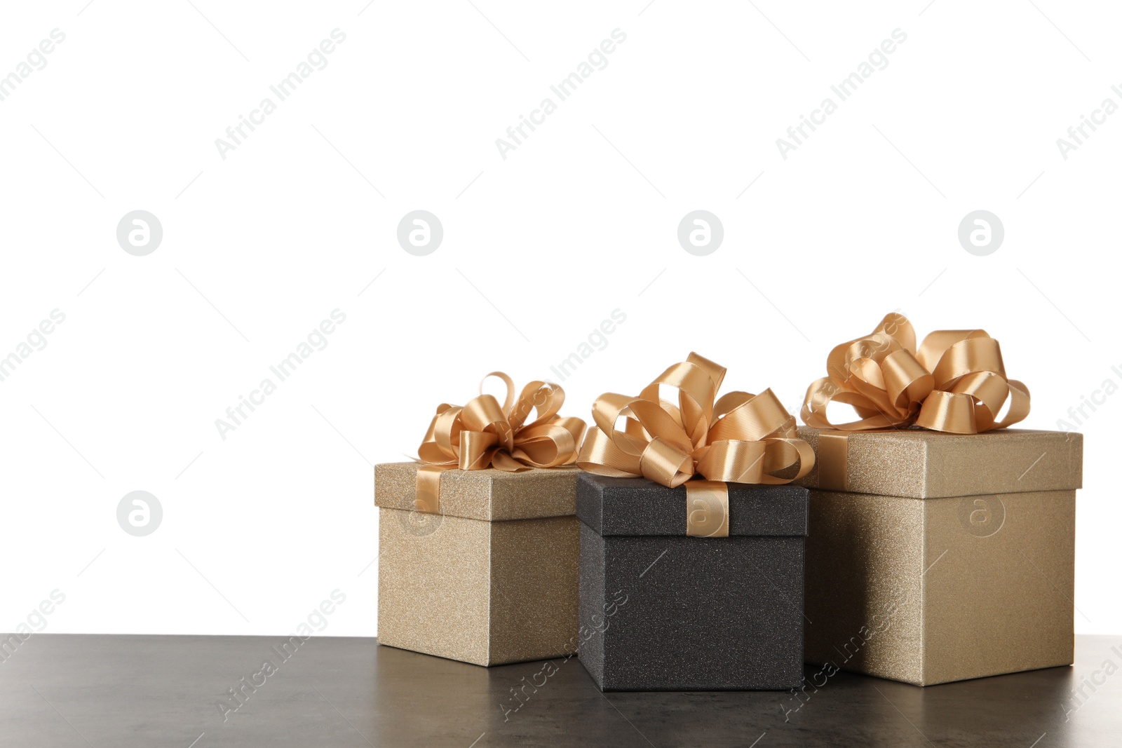 Photo of Beautiful gift boxes on dark table. Space for text