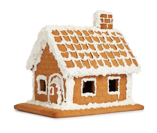 Photo of Beautiful gingerbread house decorated with icing on white background