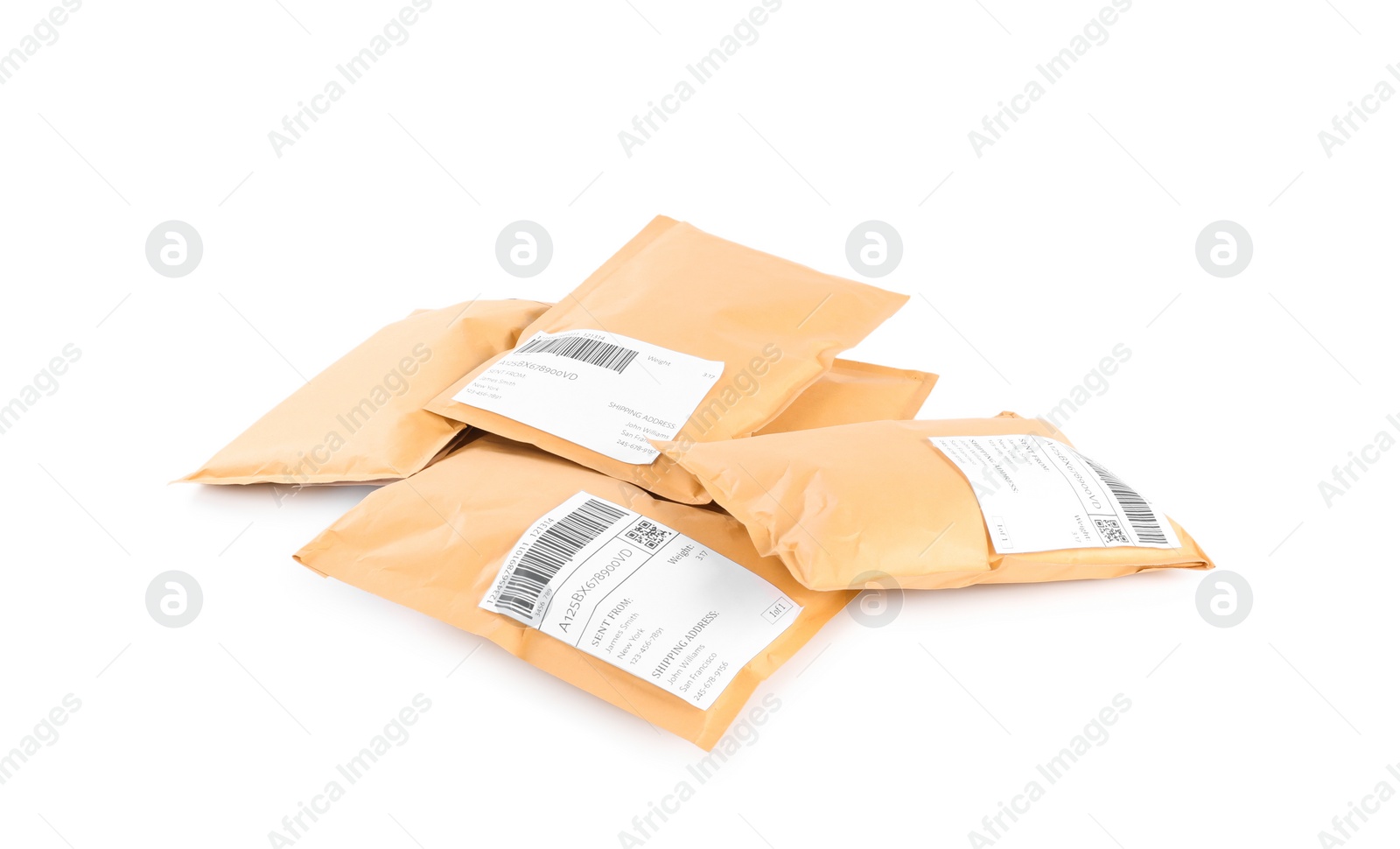 Photo of Padded envelopes on white background. Parcel delivery