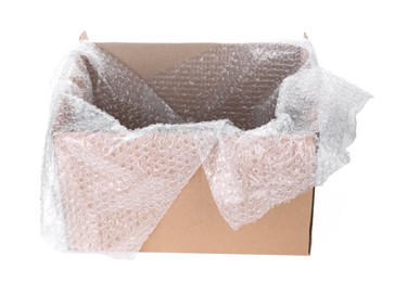 Photo of Transparent bubble wrap in cardboard box isolated on white