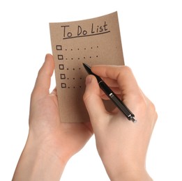 Photo of Woman filling To Do list on white background, closeup