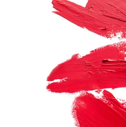 Red lipstick smears on white background, top view. Space for text