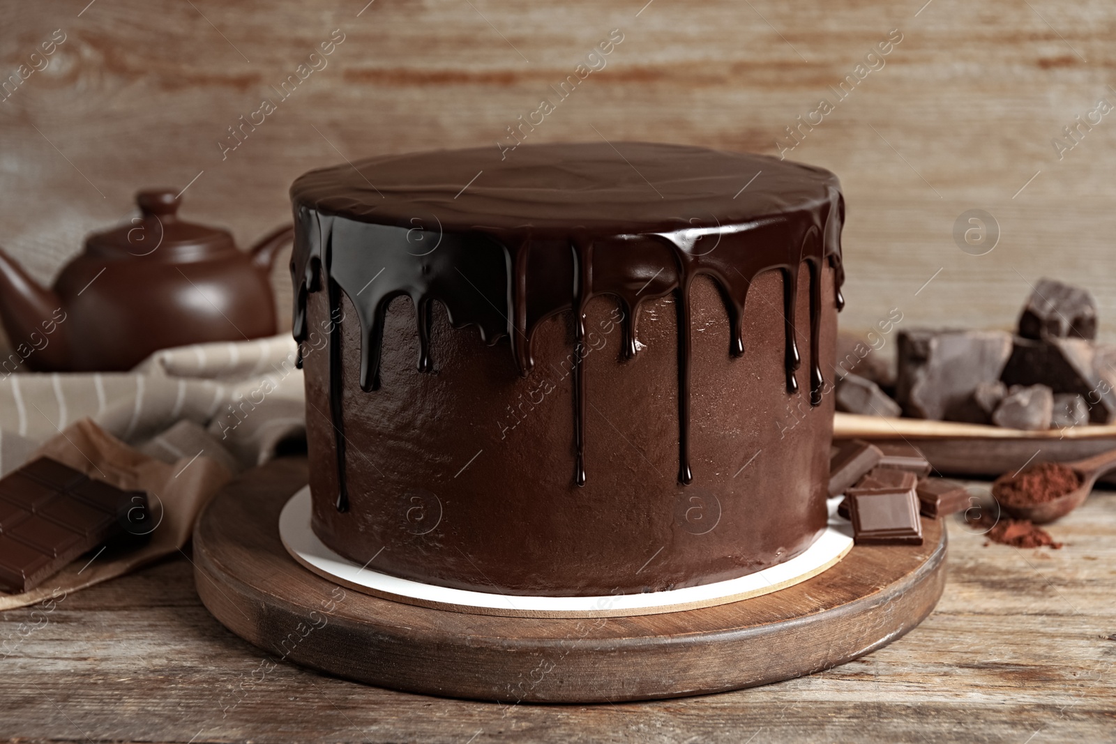 Photo of Freshly made delicious chocolate cake on wooden table