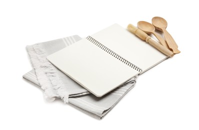 Photo of Blank recipe book, napkin and wooden utensils on white background. Space for text