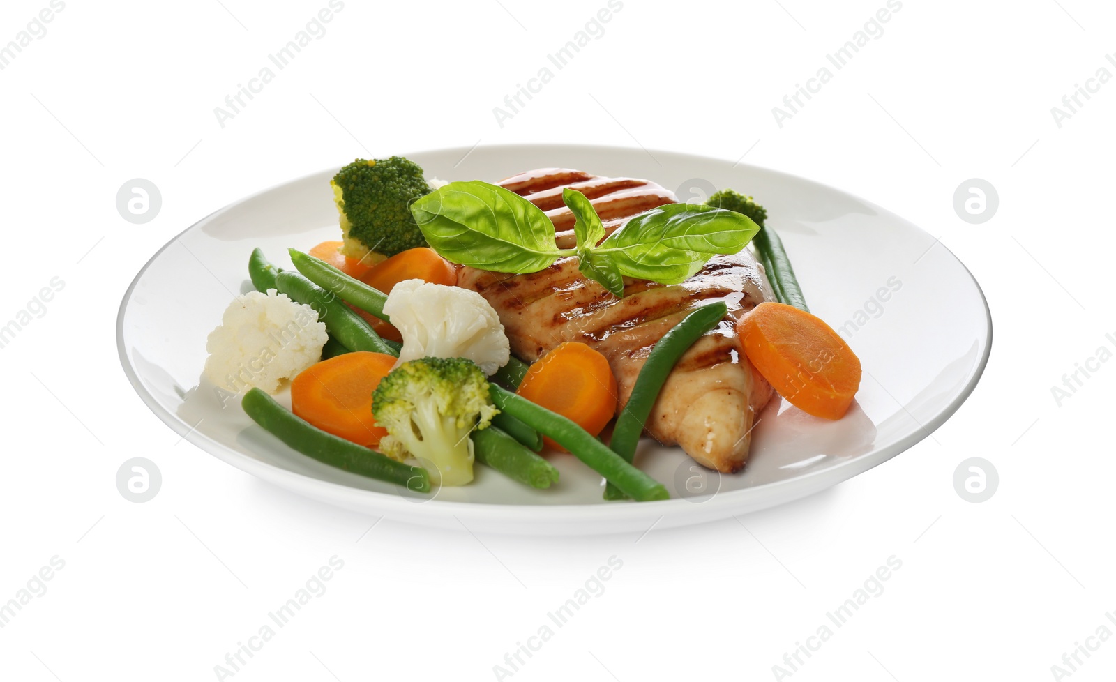 Photo of Tasty grilled chicken fillet with green basil and vegetables isolated on white