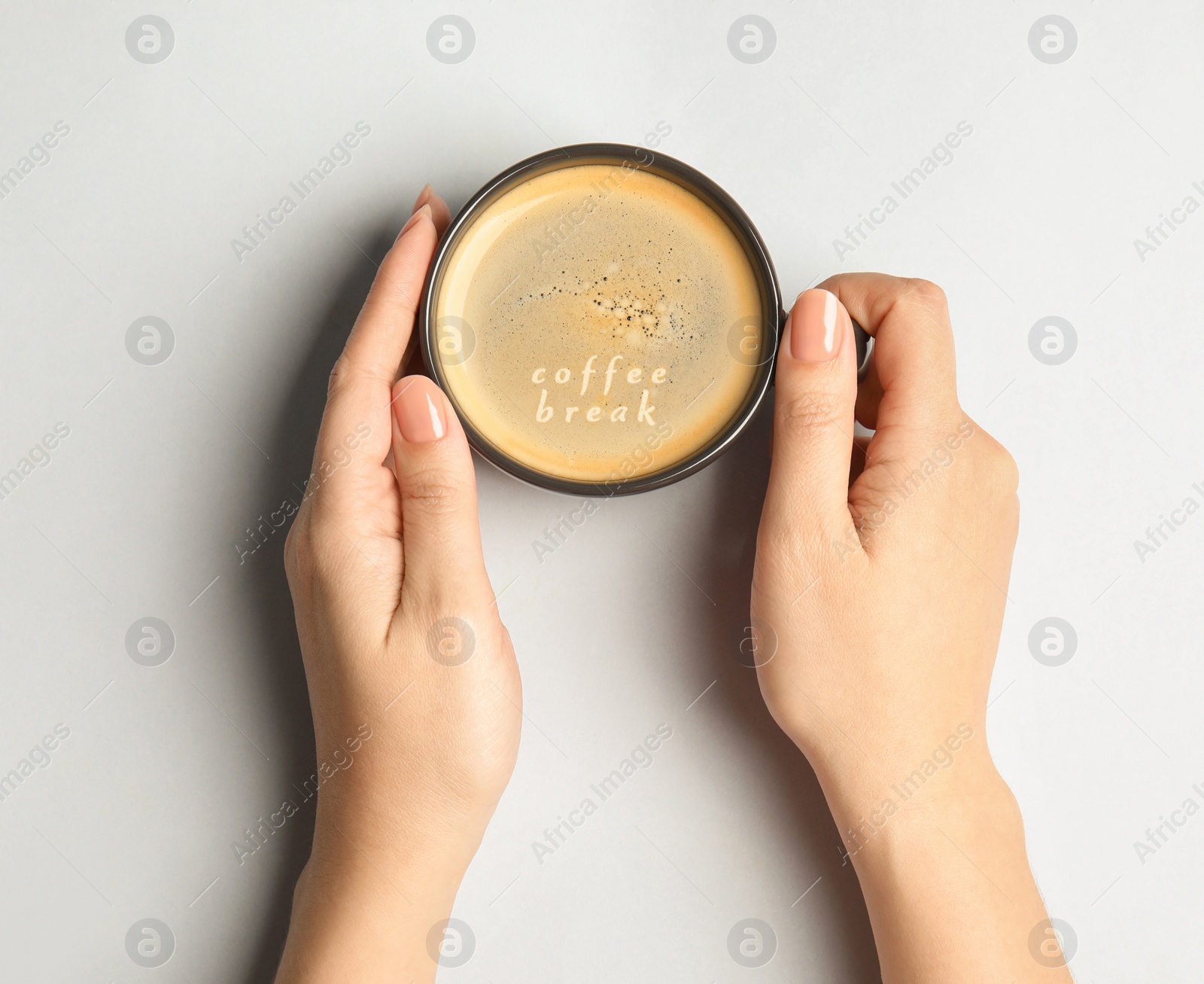 Image of Coffee Break. Woman with cup of americano at white table, top view