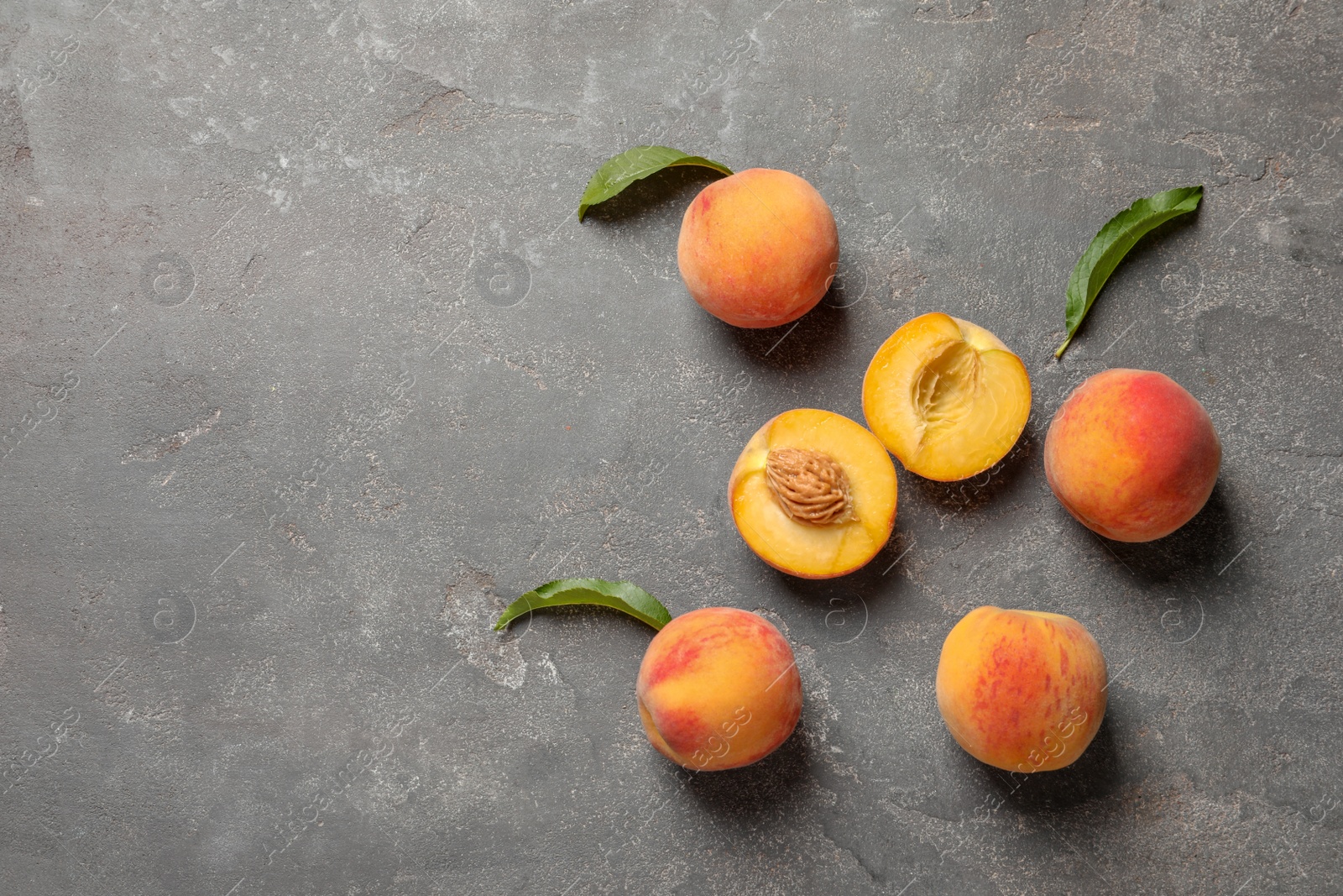 Photo of Fresh sweet peaches on table, top view