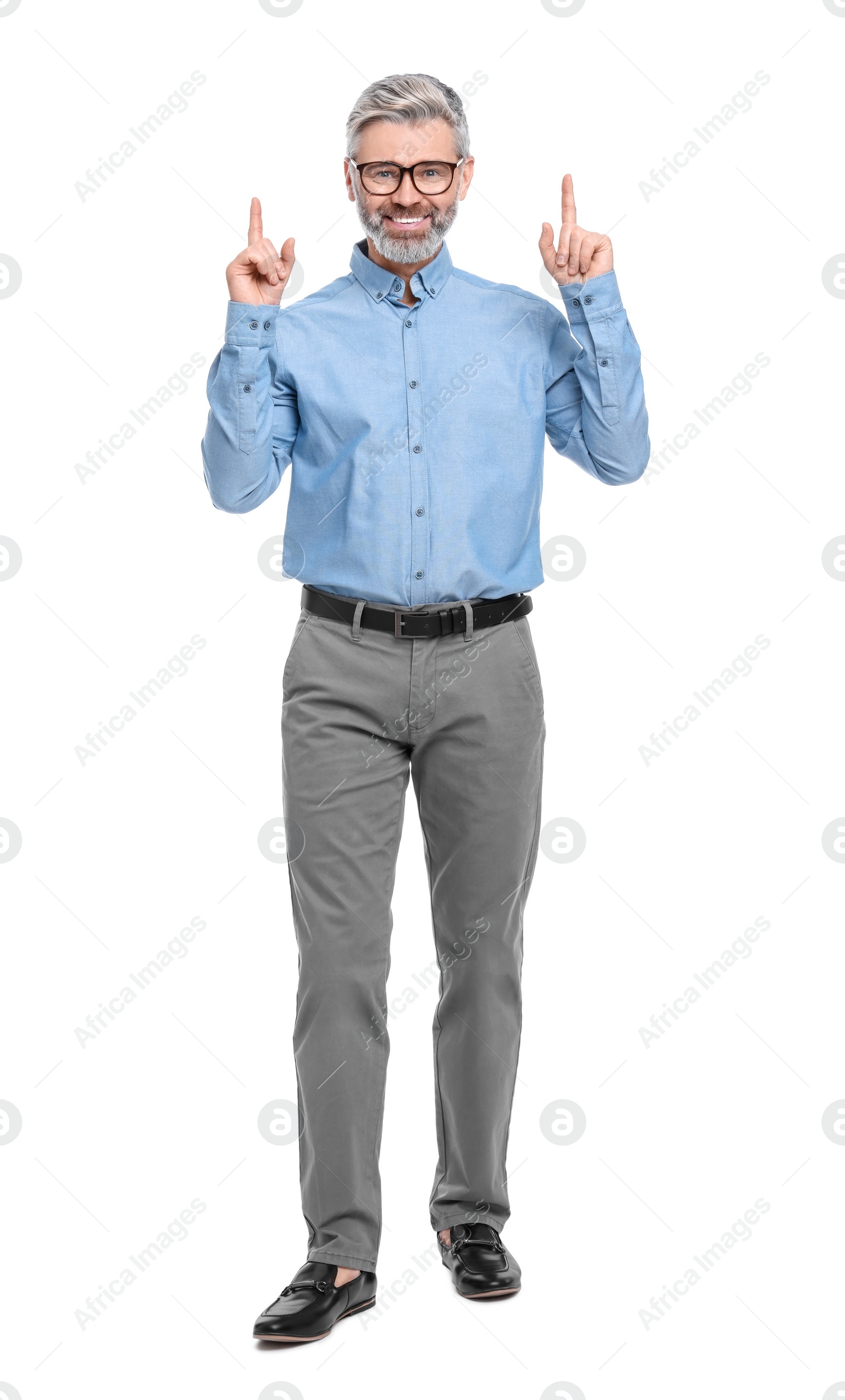 Photo of Mature businessman in stylish clothes posing on white background