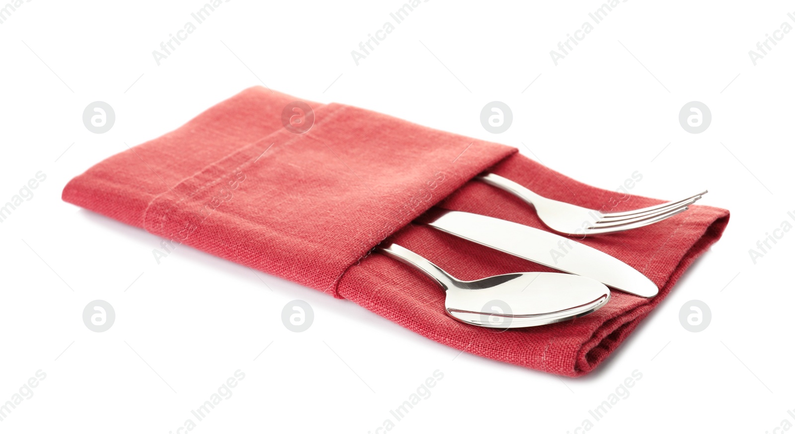 Photo of Folded napkin with fork, spoon and knife on white background