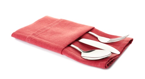 Photo of Folded napkin with fork, spoon and knife on white background