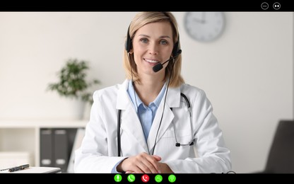 Image of Online medical consultation. Doctor with headset working via video chat application