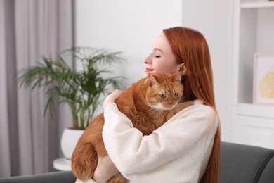 Photo of Woman with her cute cat at home