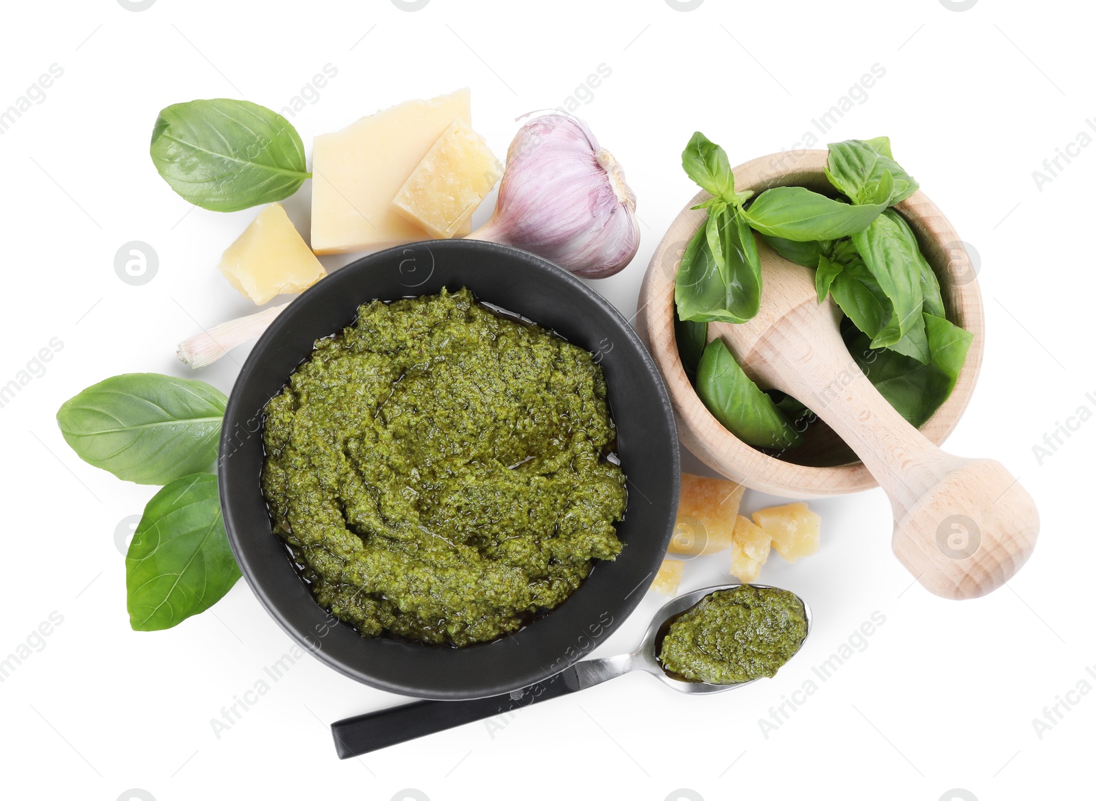 Photo of Fresh tasty pesto sauce and ingredients isolated on white, top view