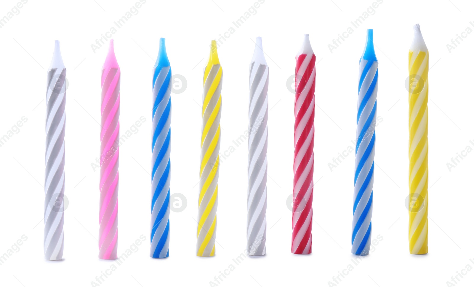 Photo of Set of colorful striped birthday candles isolated on white