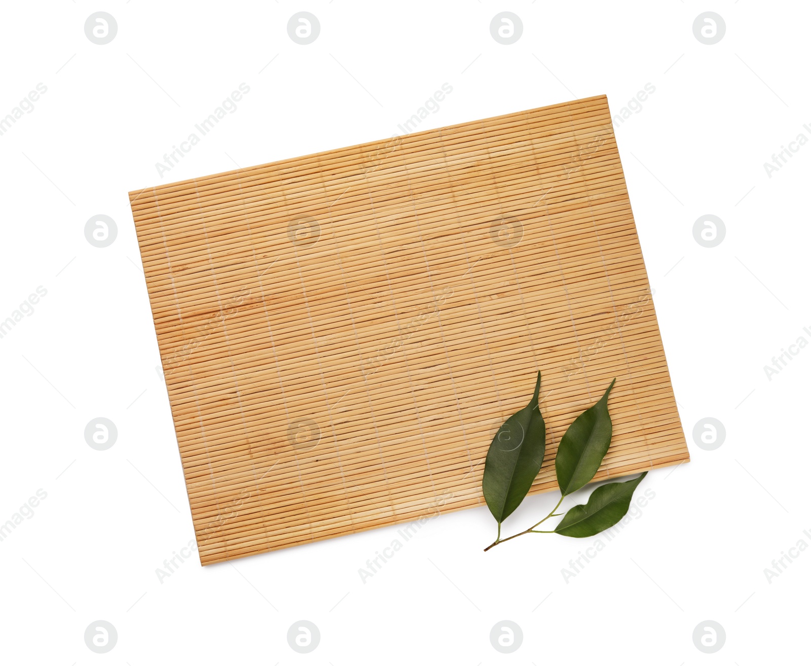 Photo of Bamboo mat and green leaves isolated on white, top view