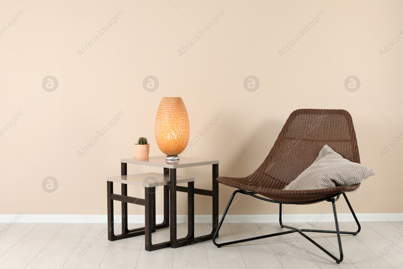 Photo of Comfortable armchair in stylish living room interior with space for text