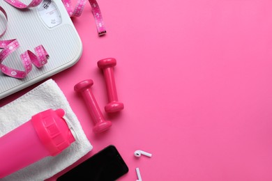 Flat lay composition with scales and measuring tape on pink background, space for text