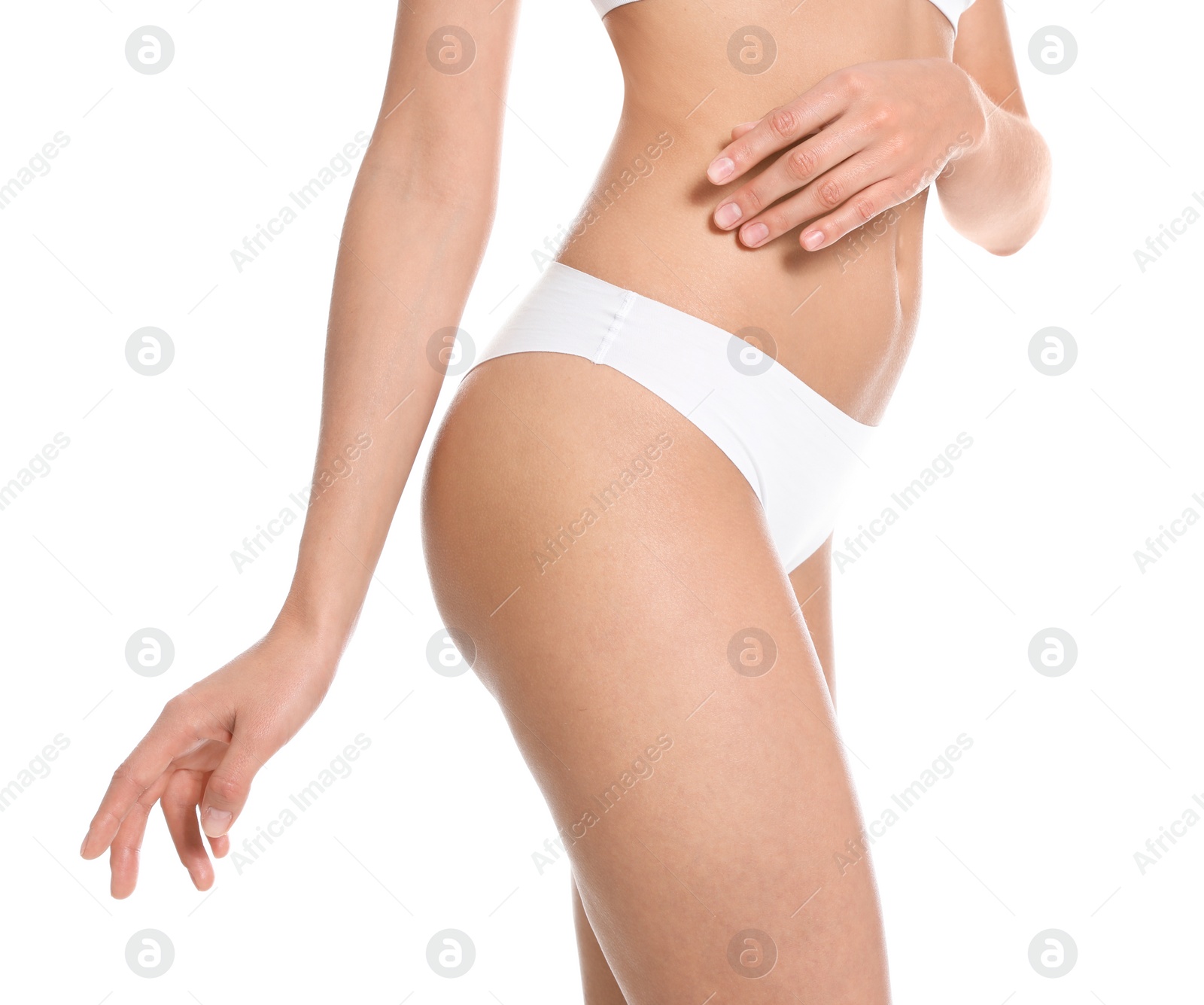 Photo of Slim young woman with smooth skin on white background, closeup. Beauty and body care concept