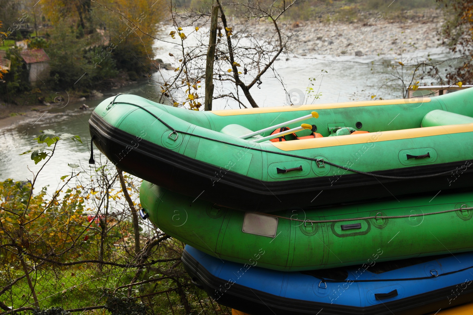 Photo of Inflatable rubber fishing boats near beautiful river