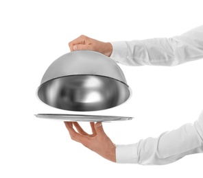 Photo of Waiter holding metal tray with lid on white background, closeup