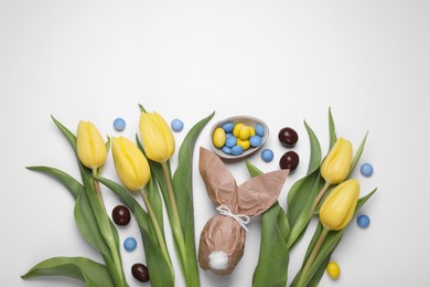 Photo of Flat lay composition with Easter bunny made of paper and egg on white background