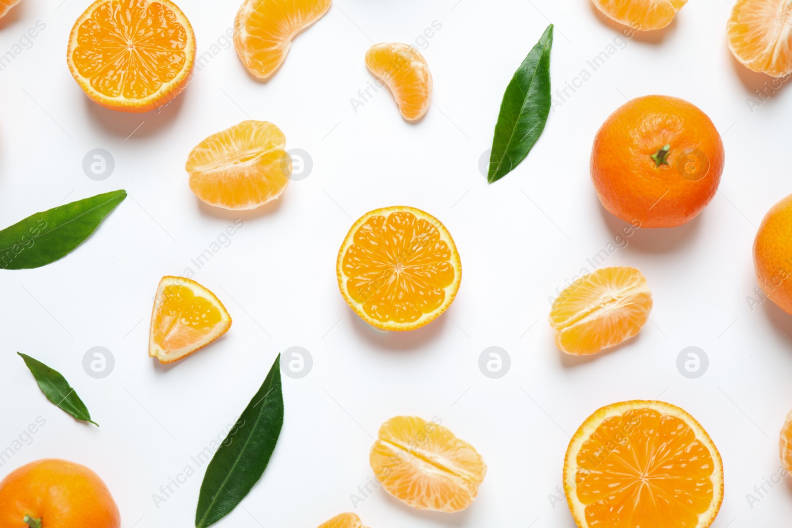 Photo of Composition with fresh ripe tangerines and leaves on white background, flat lay. Citrus fruit