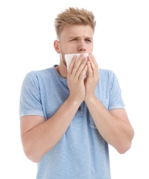 Photo of Young man suffering from allergy on white background