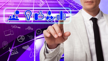 Image of Business plan. Man pointing at virtual screen with different icons, closeup 