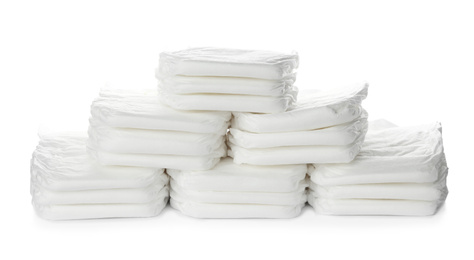 Photo of Pile of baby diapers isolated on white