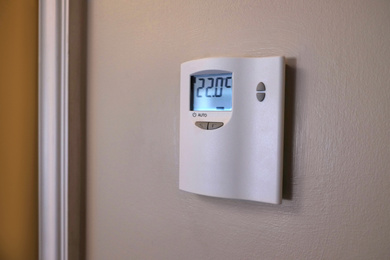 Photo of Air conditioning control system device on wall indoors