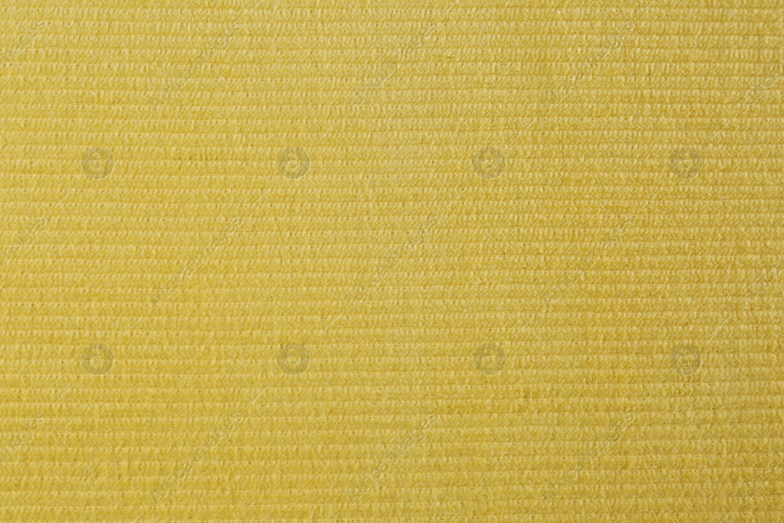 Photo of Yellow beach towel as background, top view