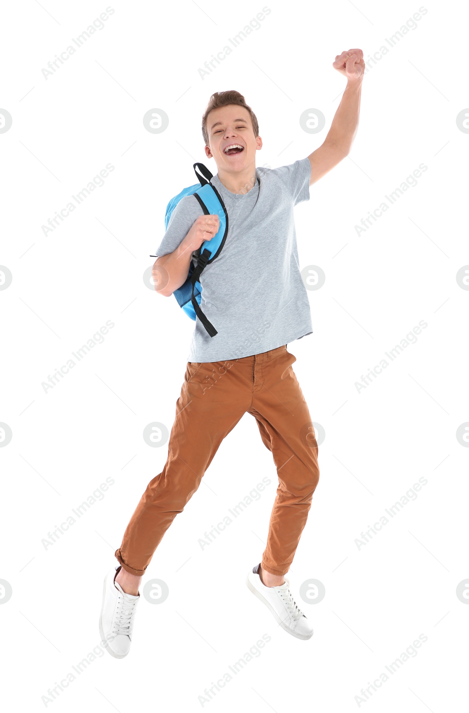 Photo of Happy teenager boy in casual clothes on white background