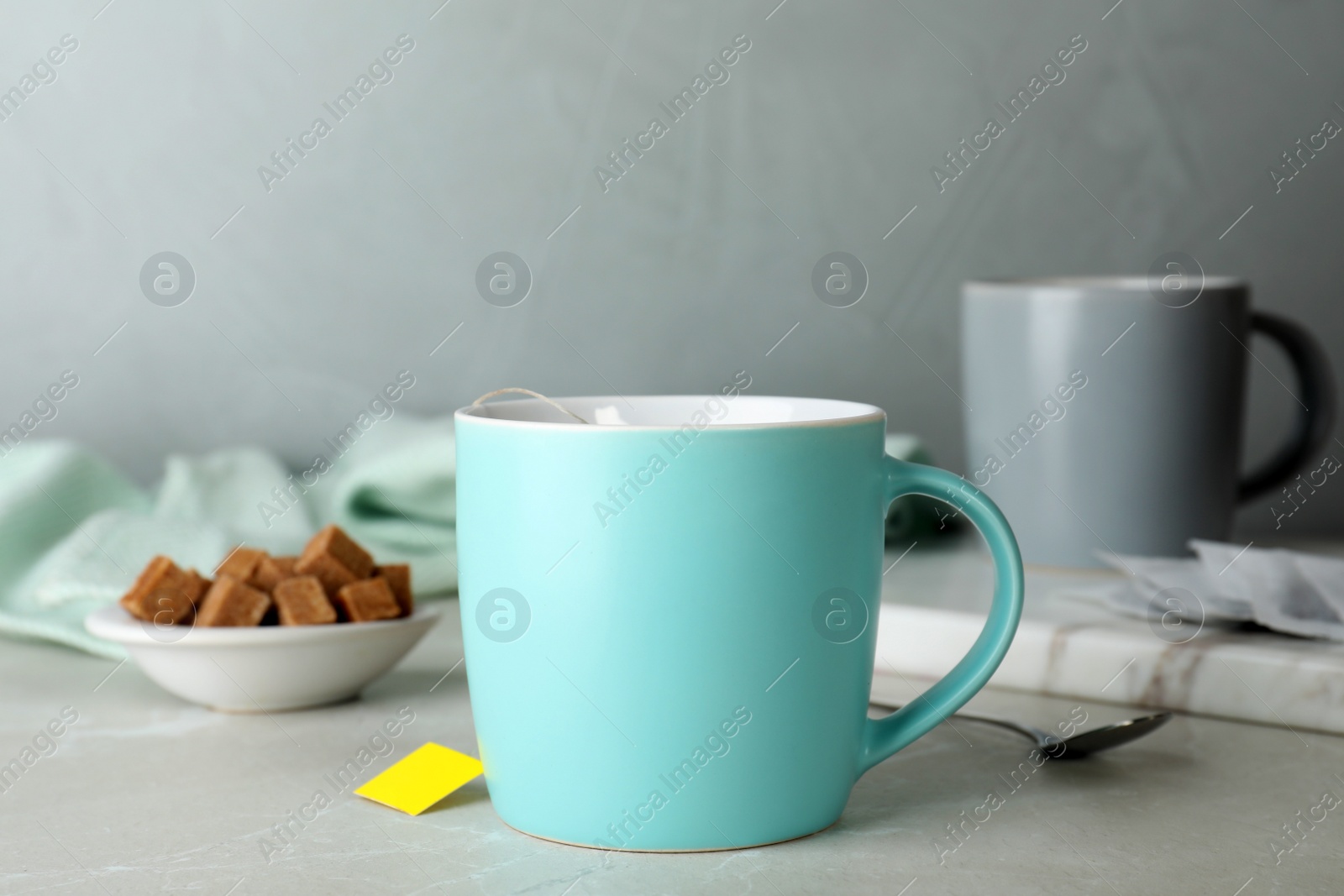 Photo of Cup of delicious hot tea on table