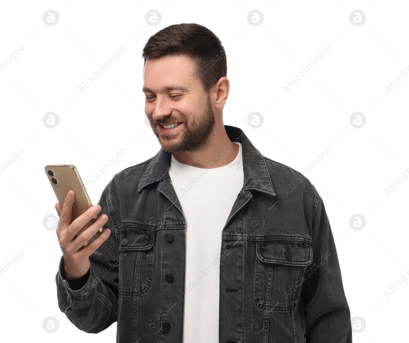 Photo of Happy man sending message via smartphone on white background