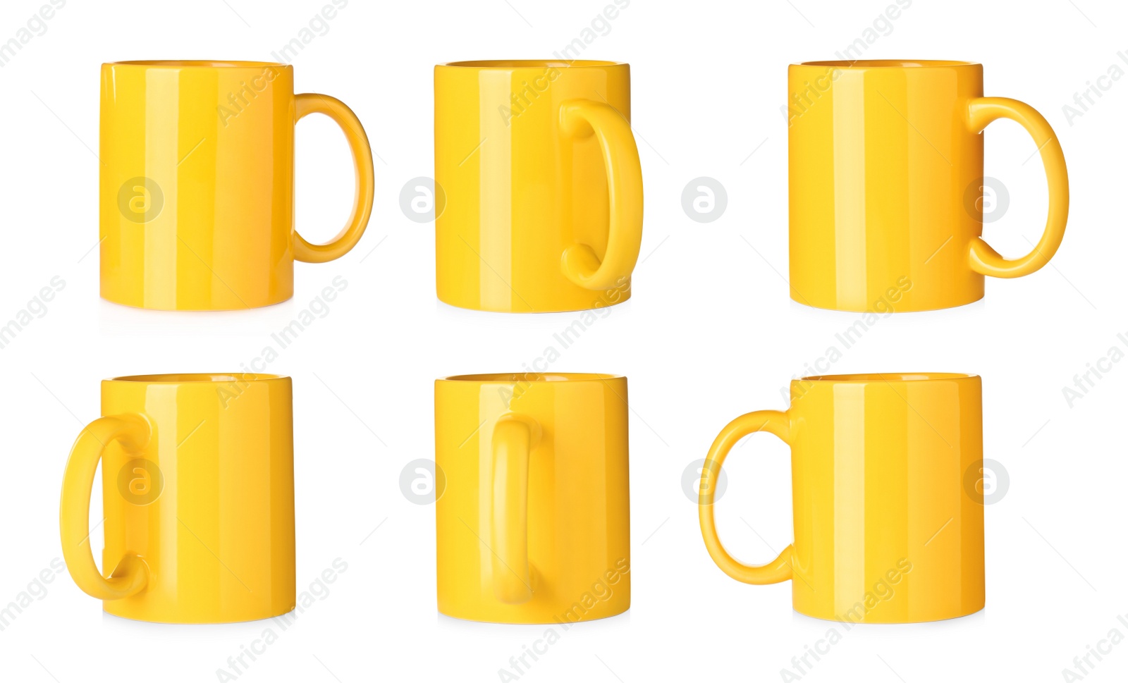 Image of Set with yellow ceramic mugs on white background