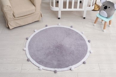Stylish soft rug on floor in room