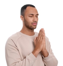 African American man with clasped hands praying to God on white background