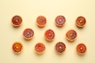 Photo of Many ripe sicilian oranges on beige background, flat lay