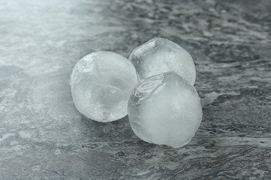 Frozen ice balls on grey marble table