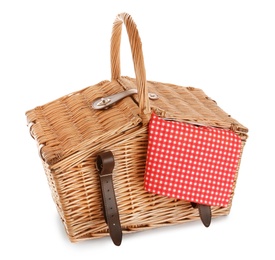 Closed wicker picnic basket with checkered tablecloth on white background