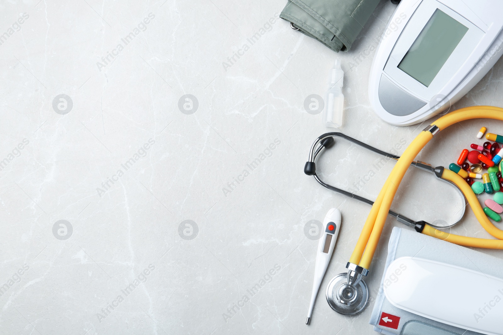 Photo of Flat lay composition with medical objects and space for text on grey background