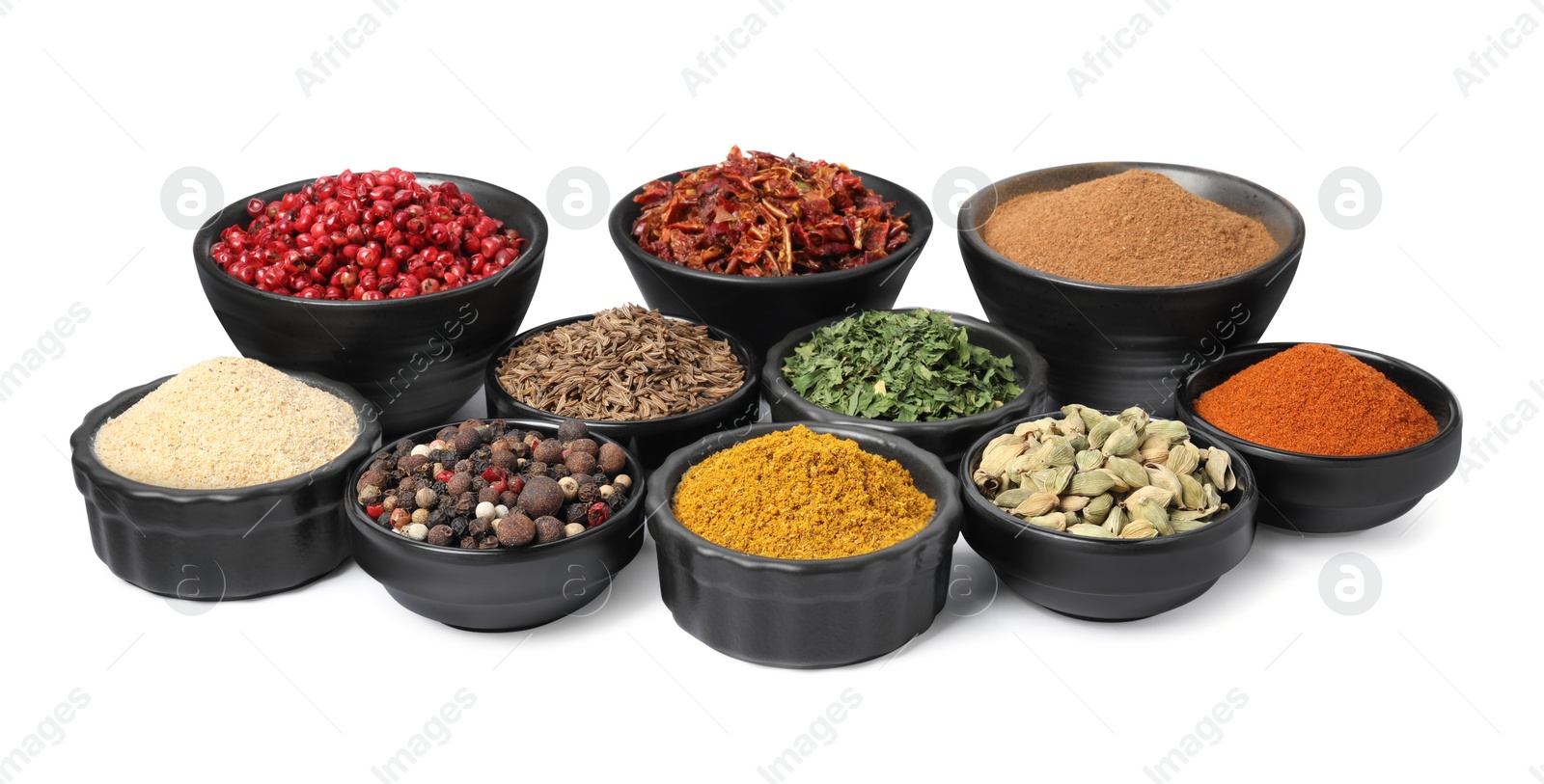 Photo of Bowls with different spices on white background