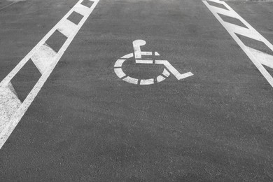 Car parking lot with wheelchair symbol outdoors