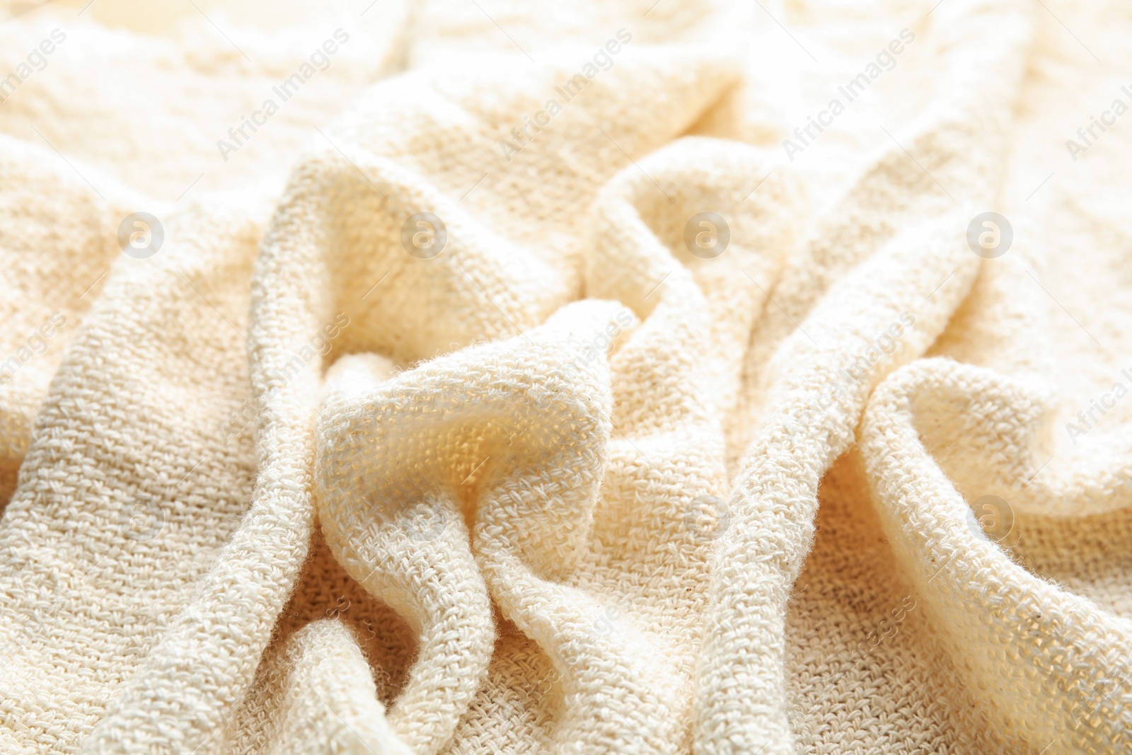 Photo of Closeup view of light natural hemp cloth. Fabric texture